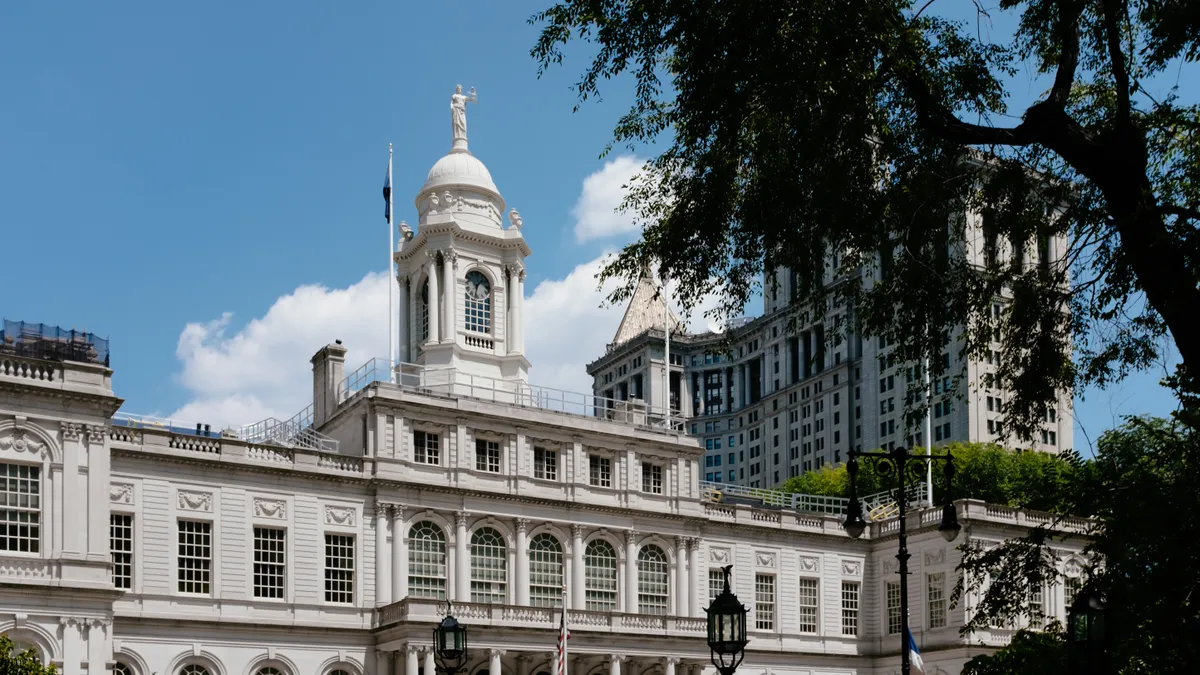 A view of the facade of New York City Hall and Manhattan Municipal Building in lower Manhattan, New York City.